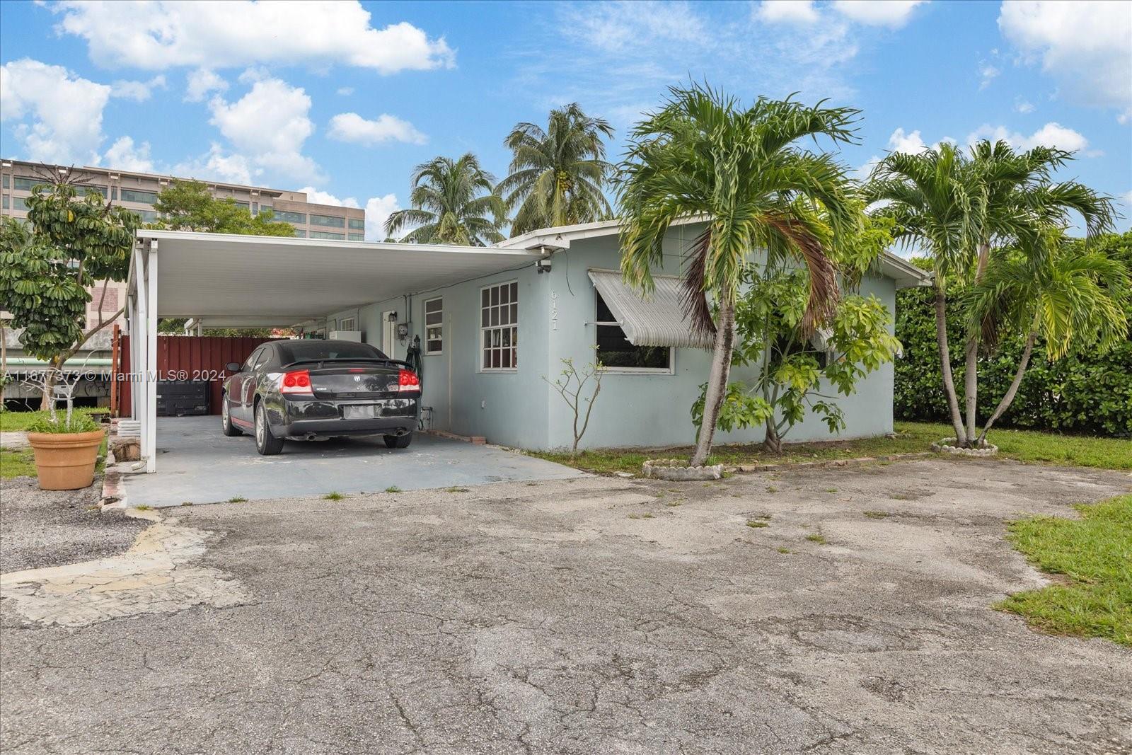 a view of car parked in front of house