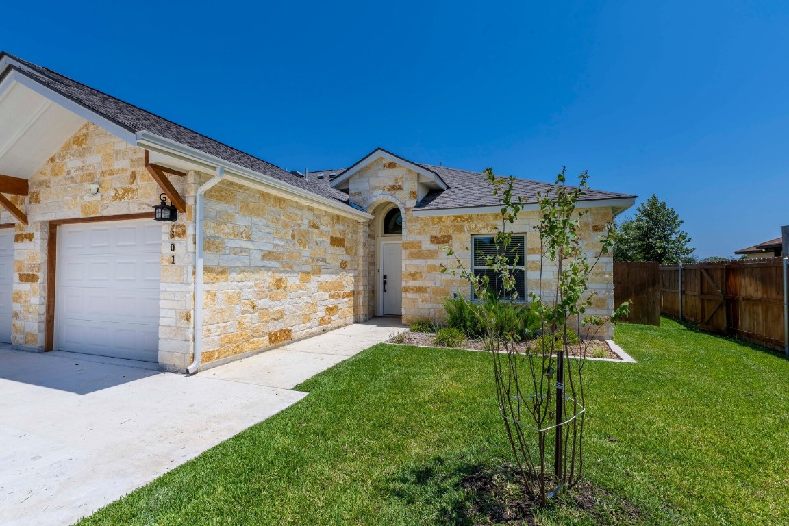 a front view of a house with a yard