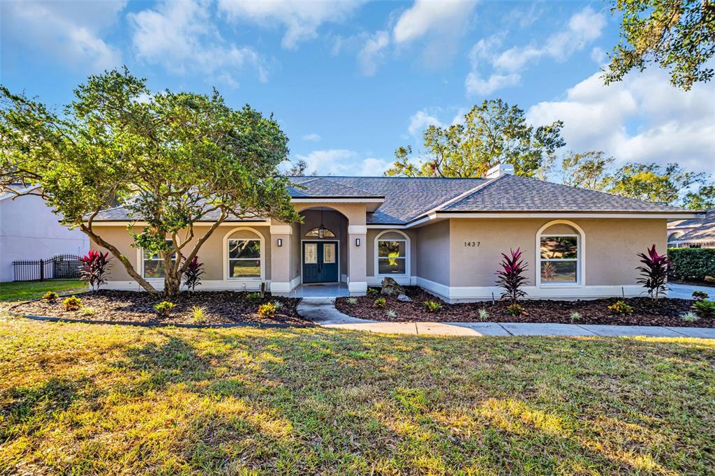 a front view of a house with a yard