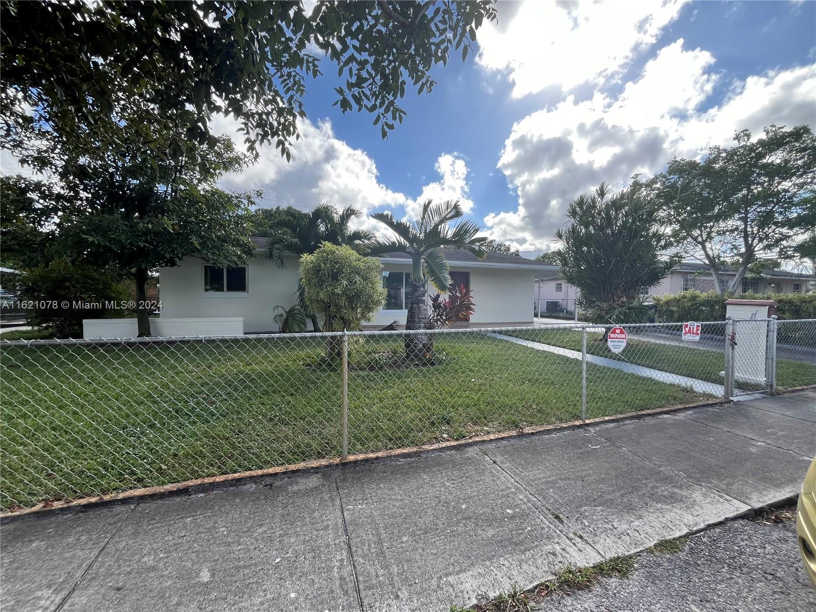 a view of backyard with green space