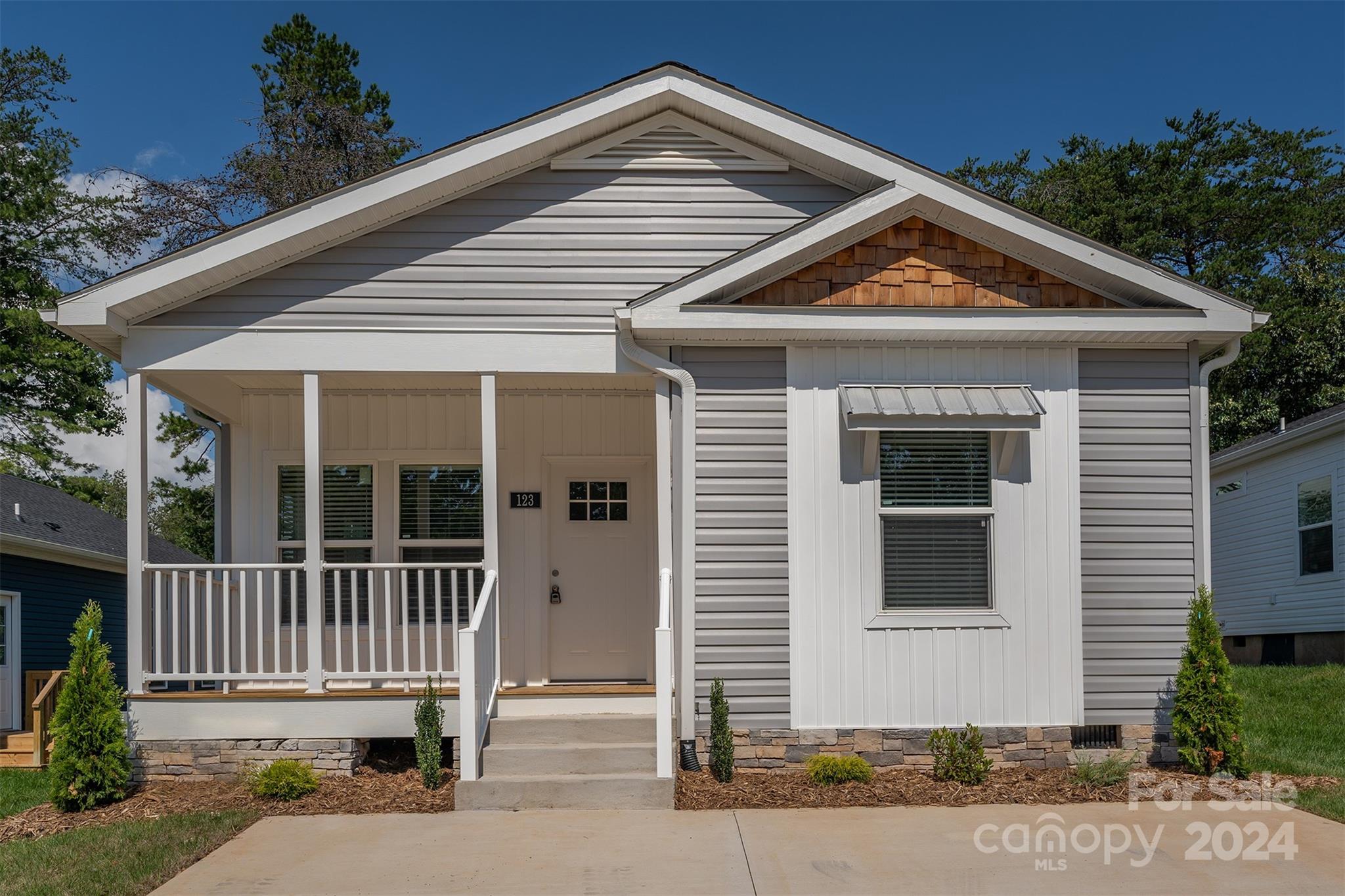 a front view of a house with a porch