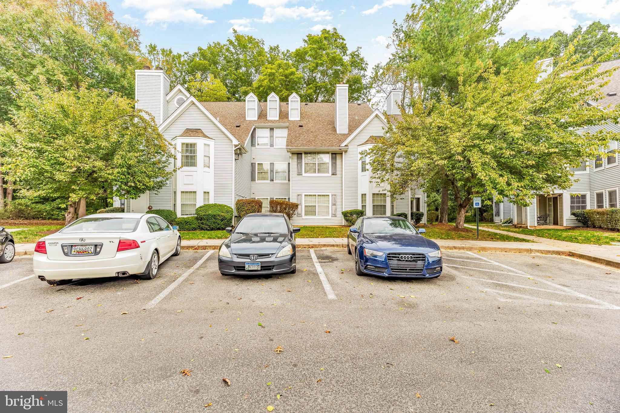 a view of a cars parked in front of a house