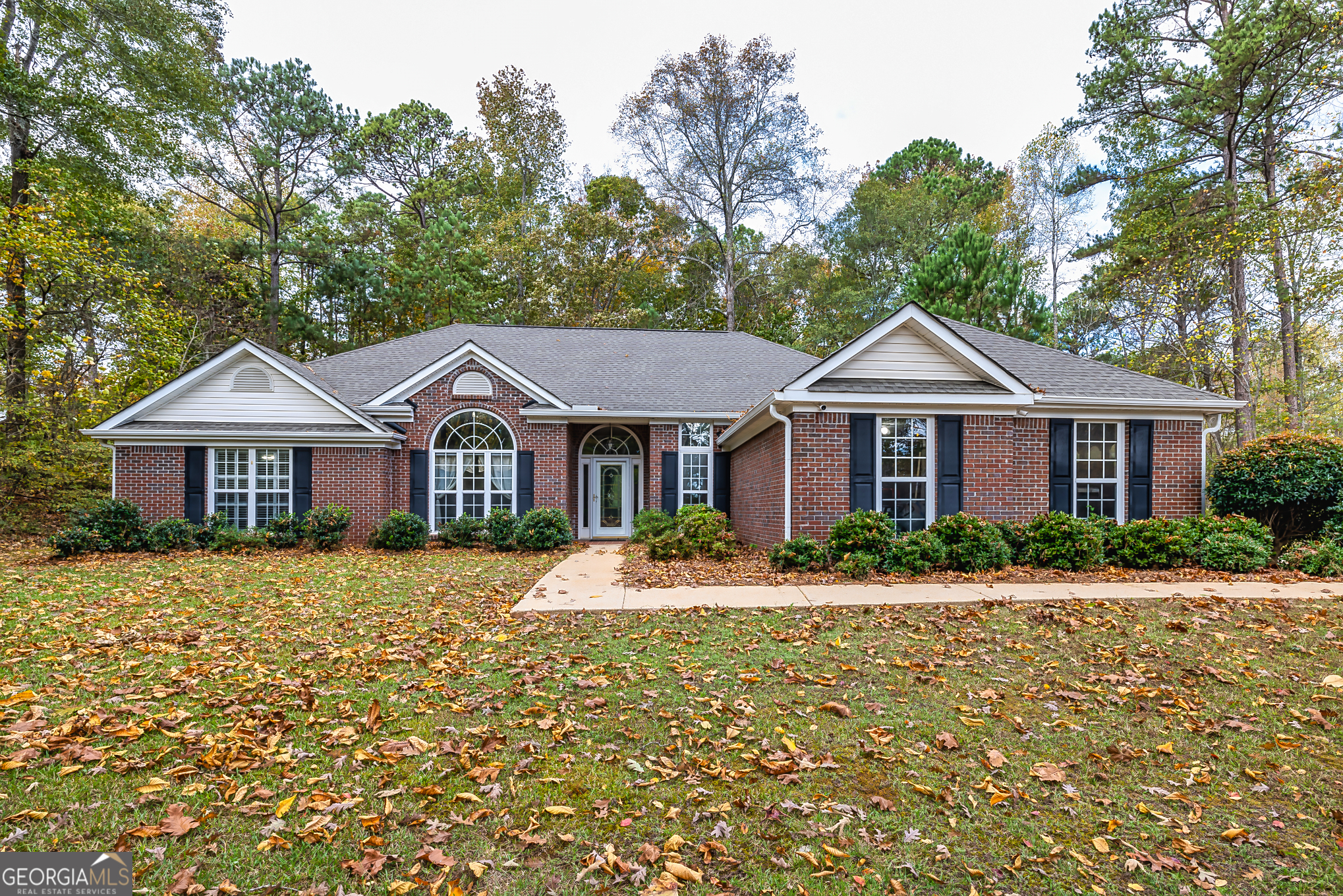 a front view of a house with a yard