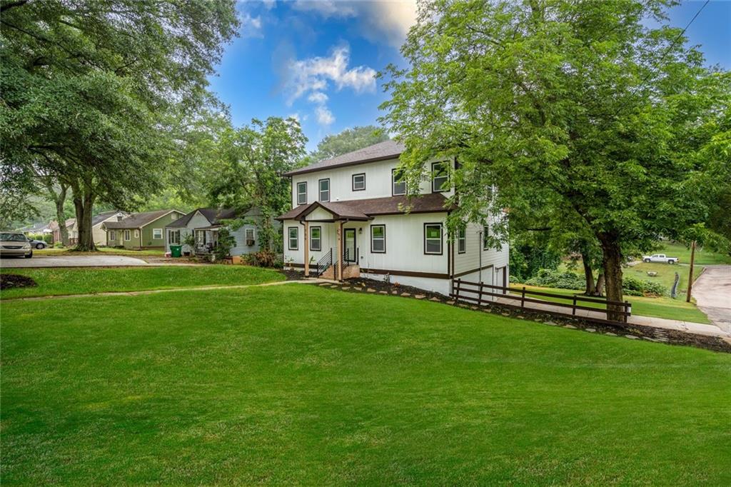 a front view of a house with a garden