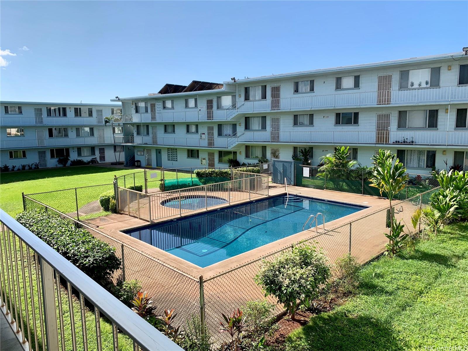 a view of building with swimming pool and outdoor seating