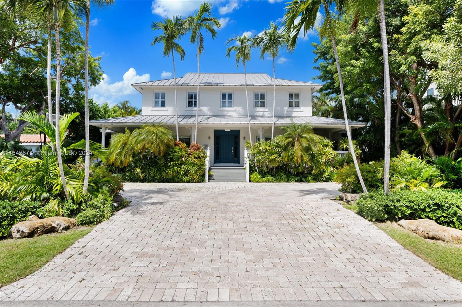 front view of a house with a garden