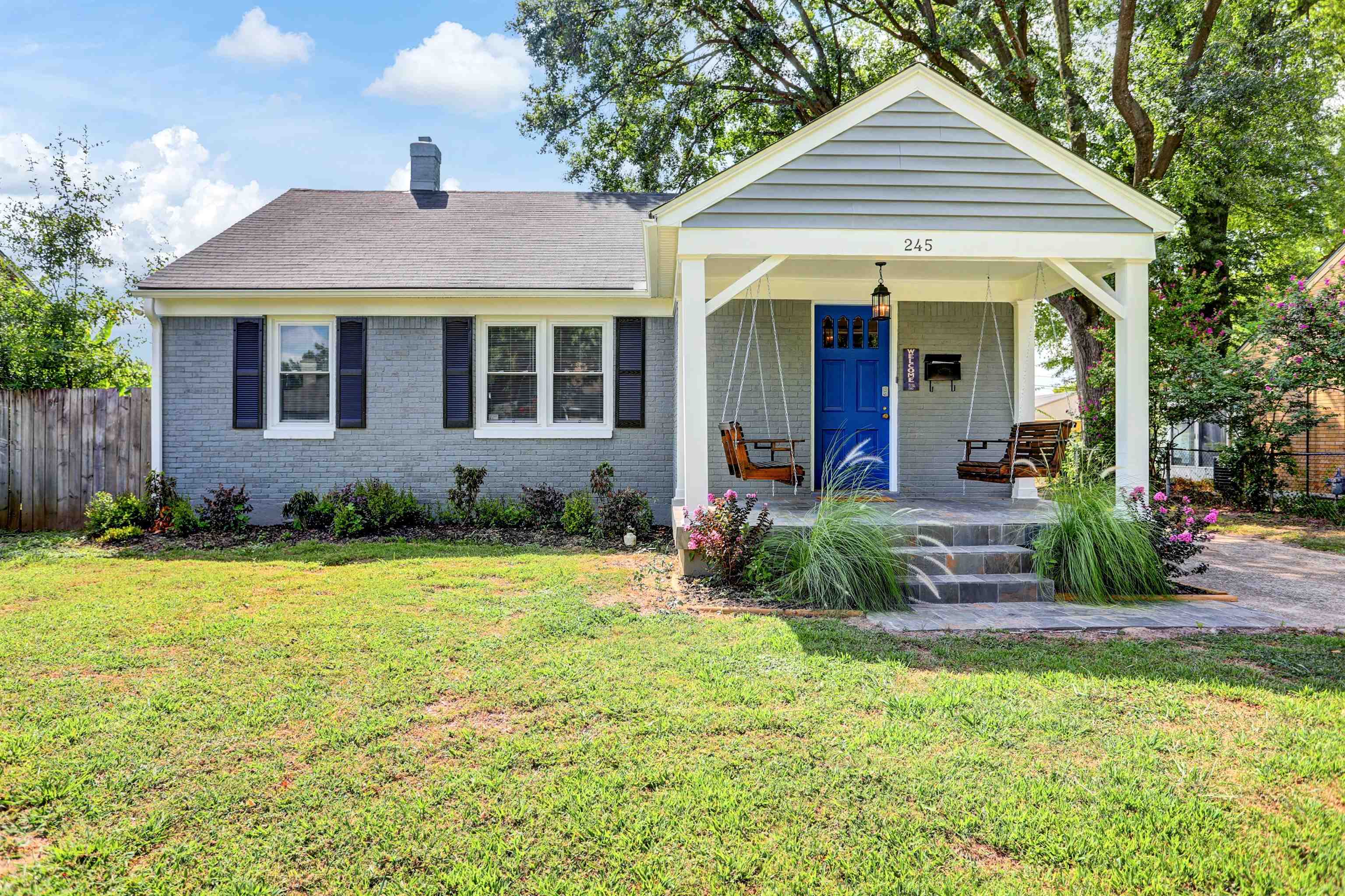 a front view of a house with garden