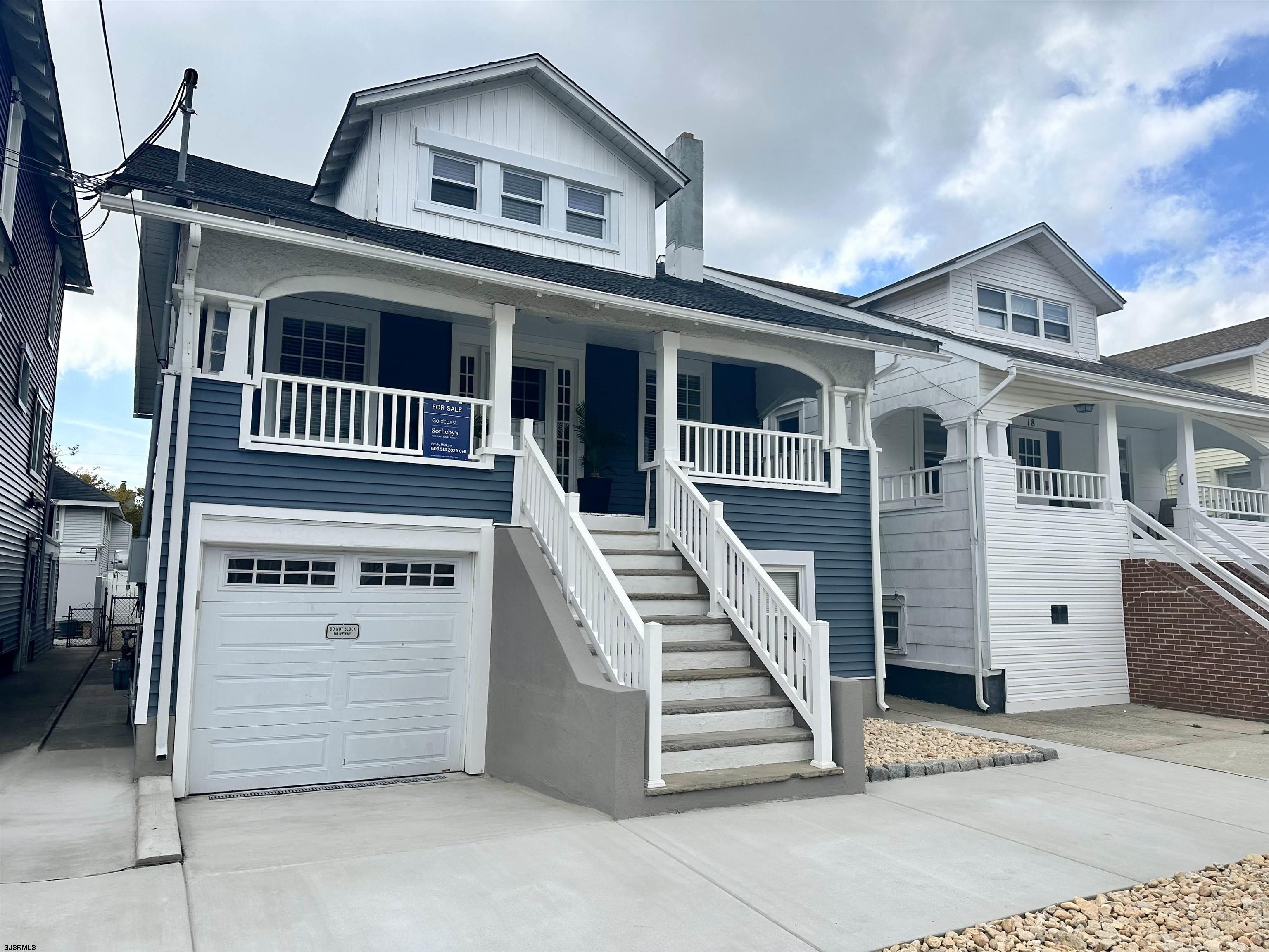 a front view of a house with a garage