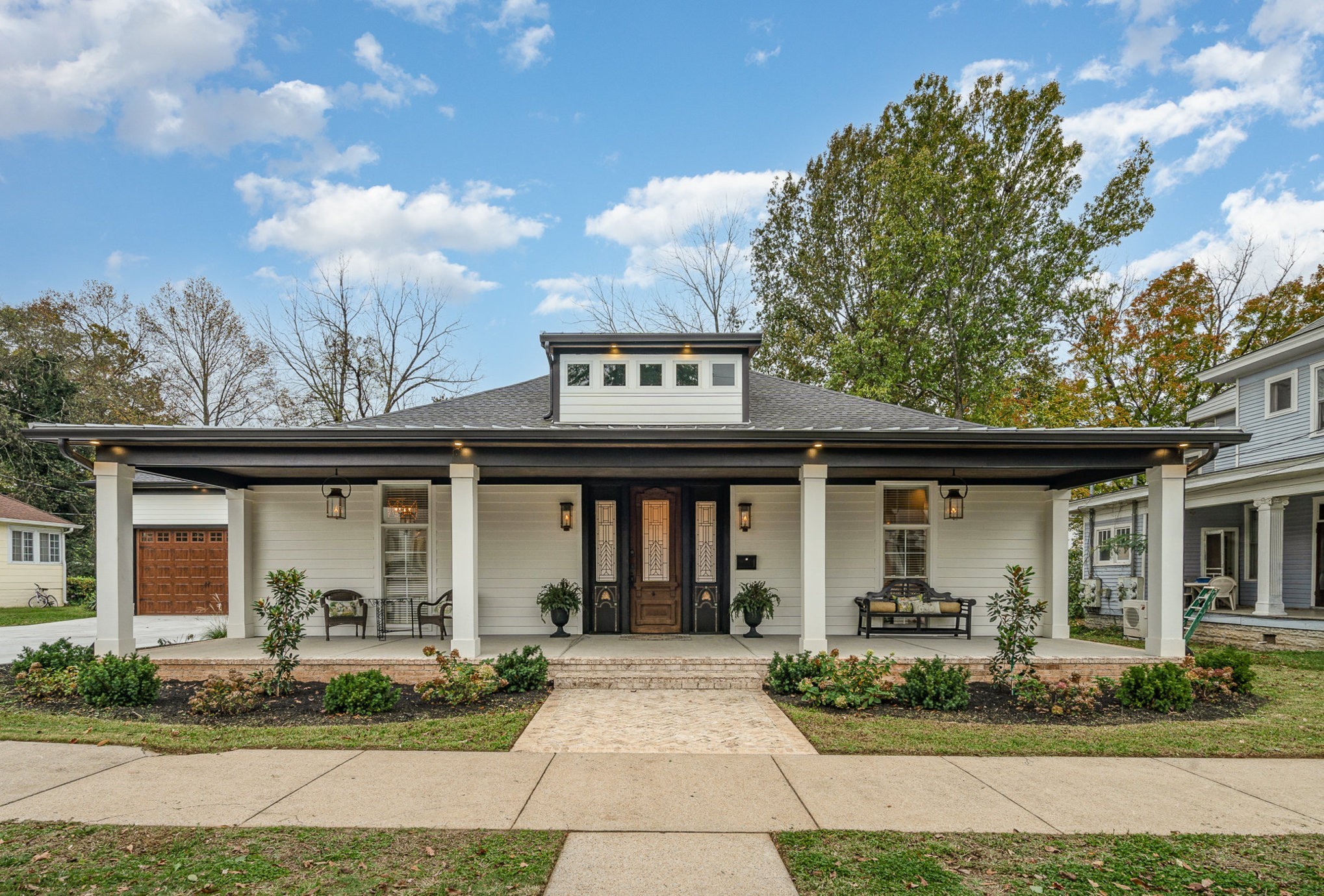 a front view of a house with garden