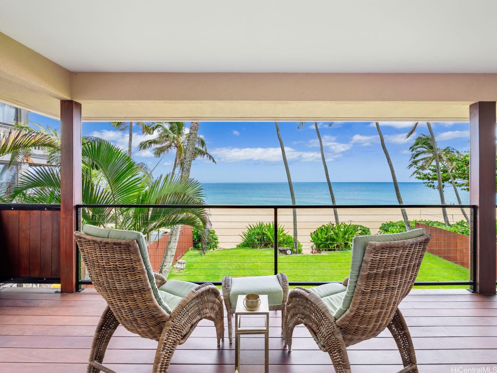 a view of an outdoor sitting area with furniture and umbrella