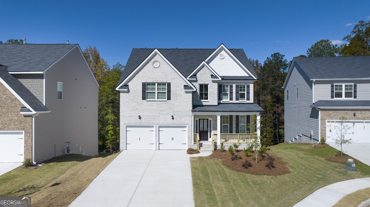 a front view of a house with seating space