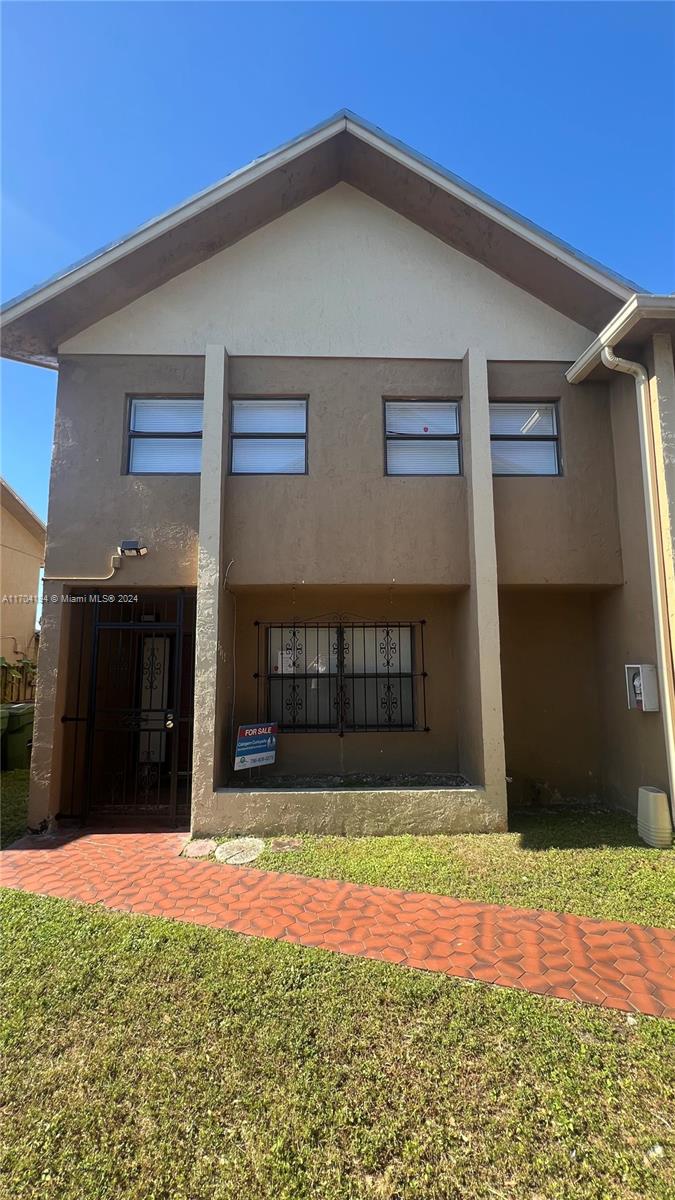 a front view of a house with garage