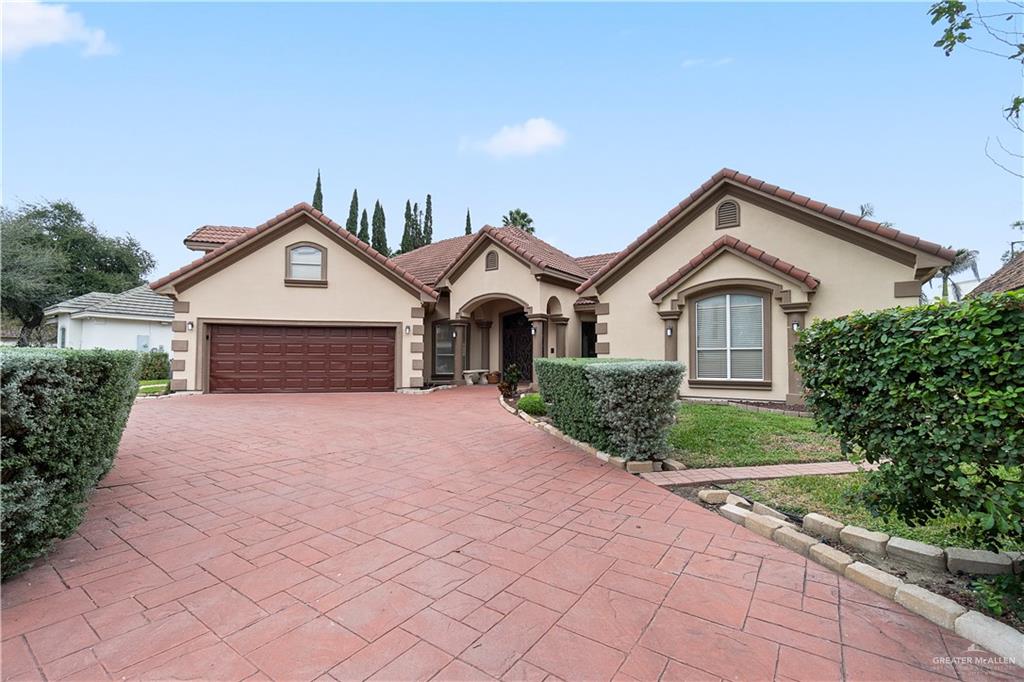 Mediterranean / spanish-style house featuring a garage