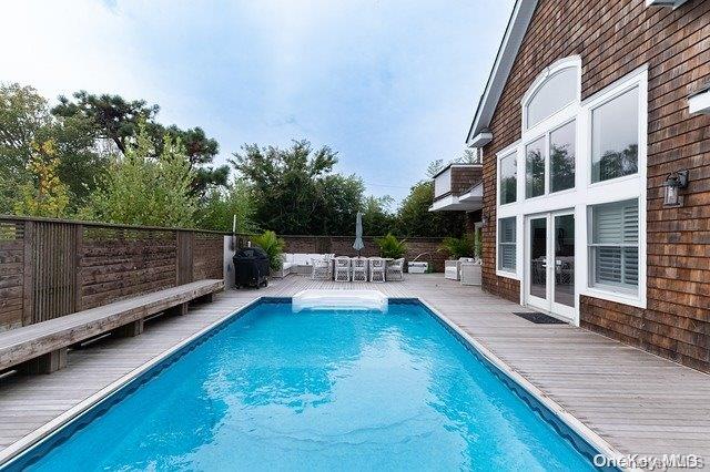 a view of a swimming pool with a patio