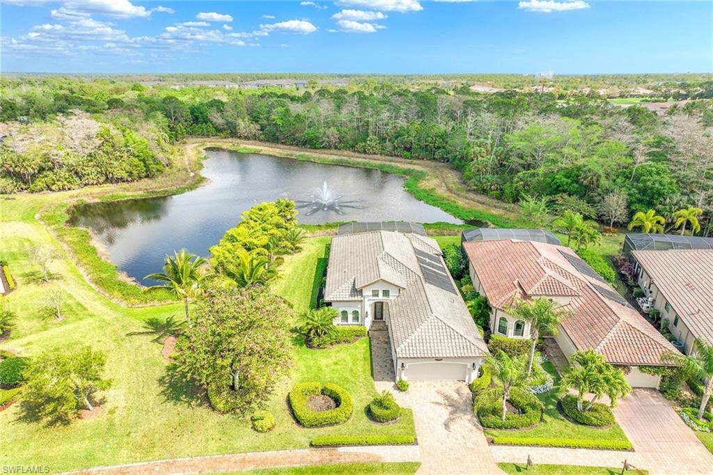 an aerial view of a house with a lake view