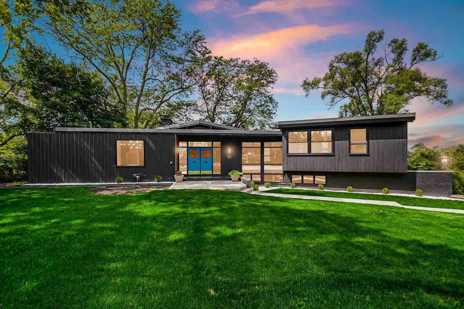 a view of a house with backyard sitting area and garden