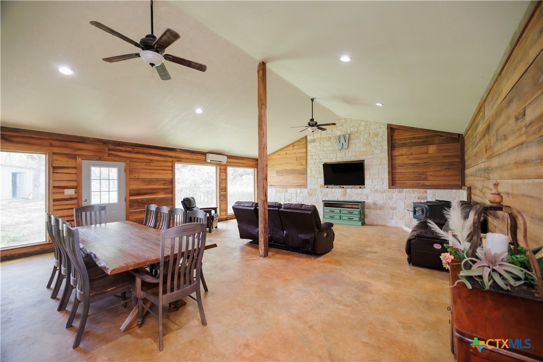 a view of a livingroom with furniture and a flat screen tv