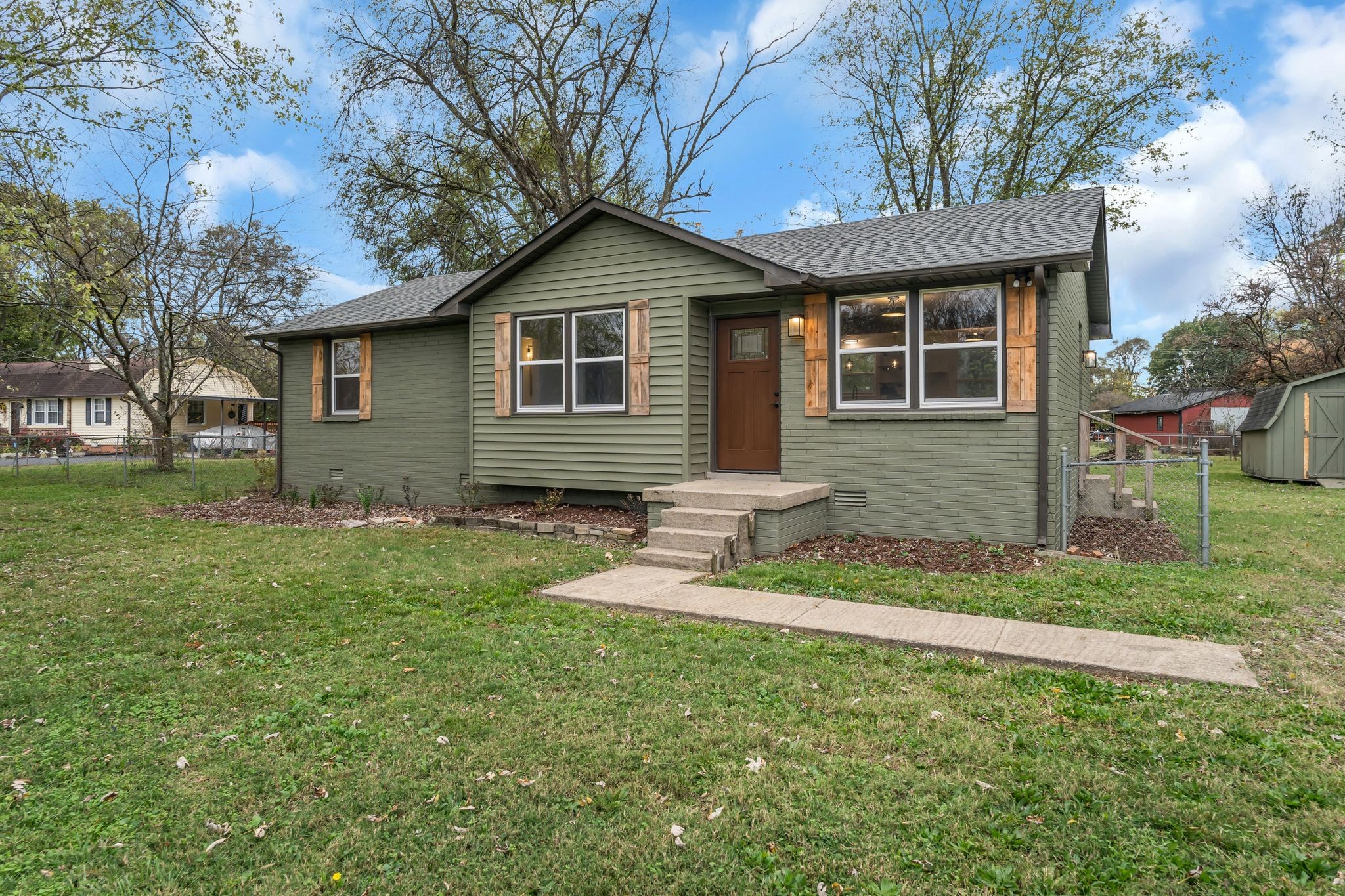 a front view of a house with a yard