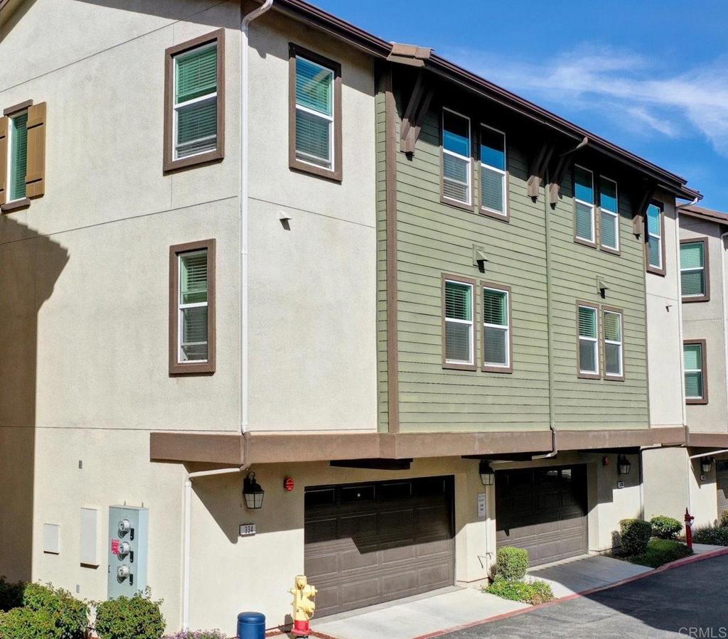 a front view of a house with parking space