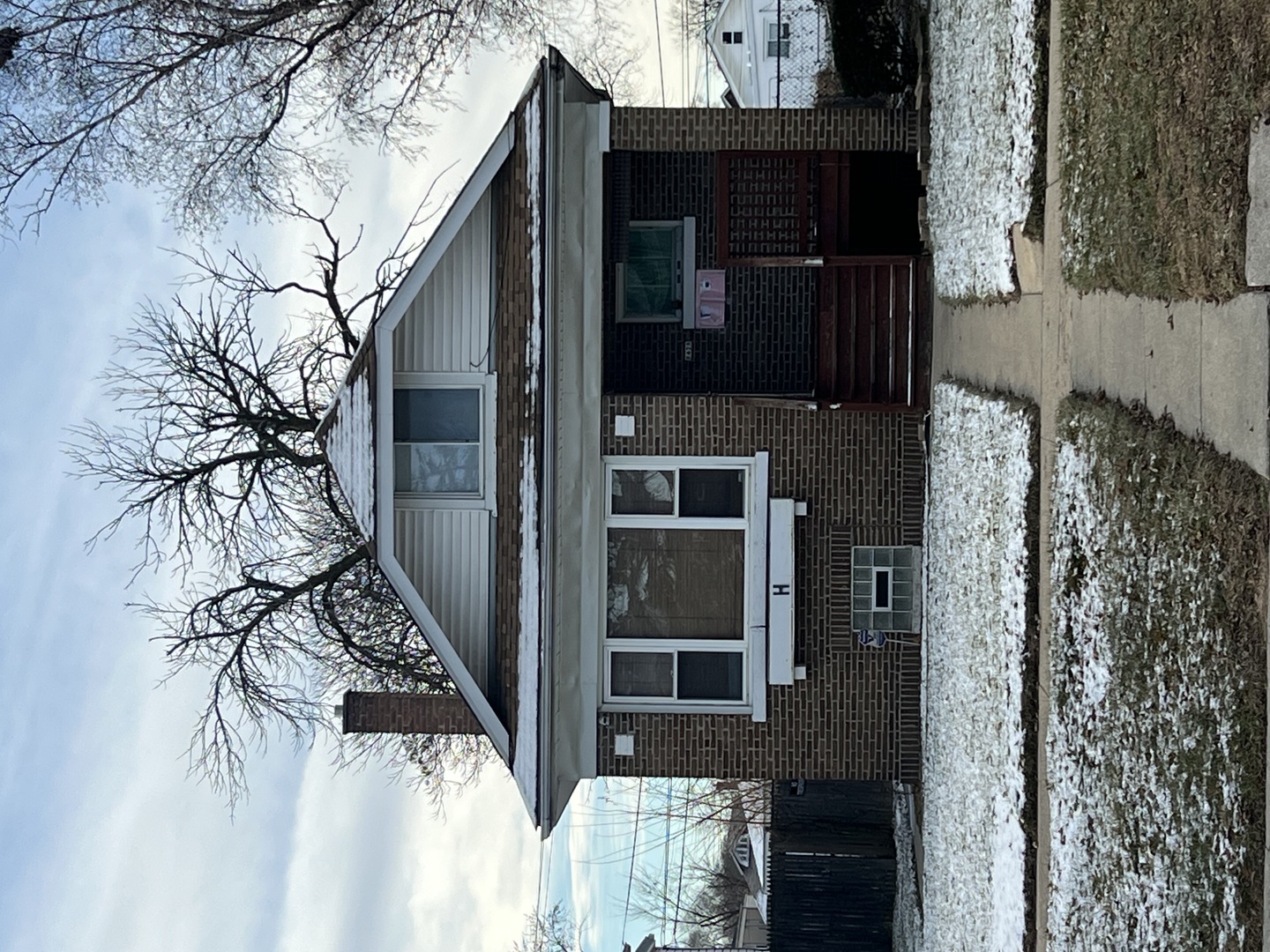 a view of a house with a tree