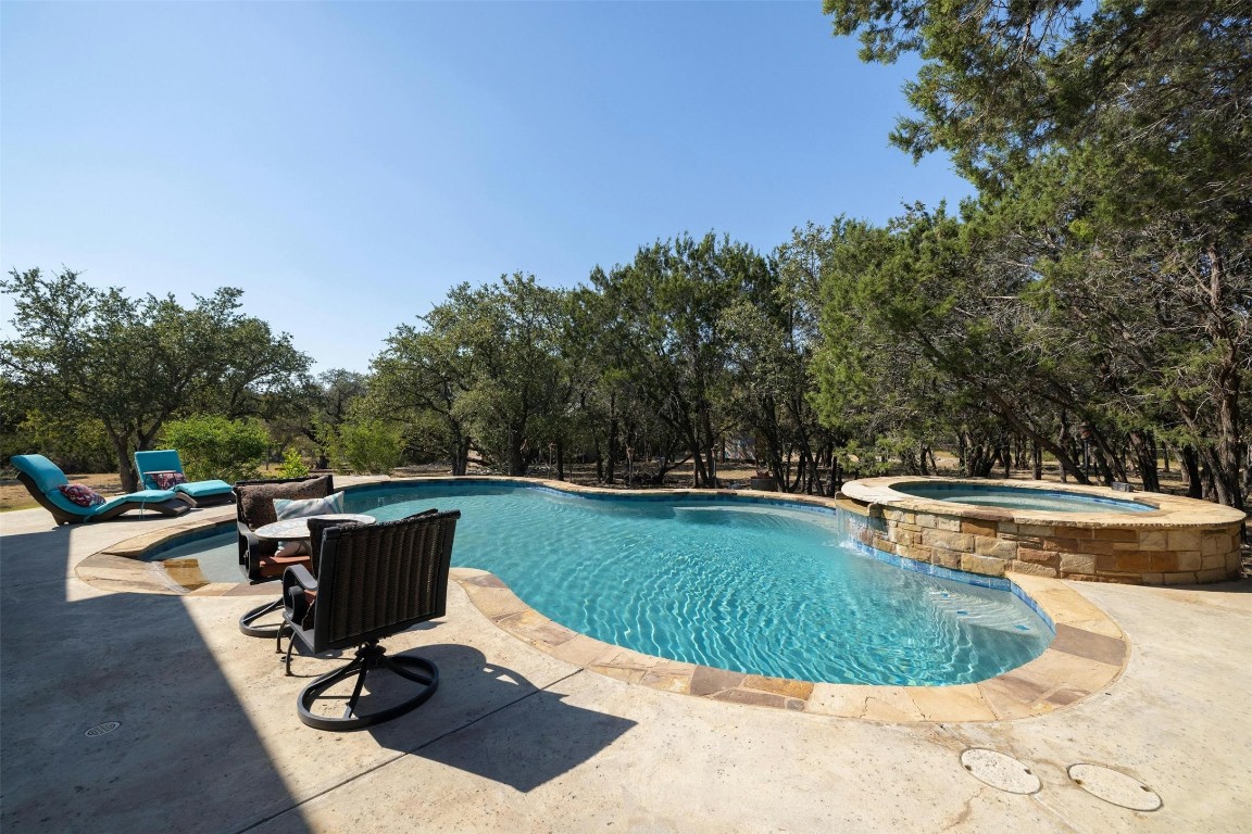 a view of a swimming pool and lounge chair