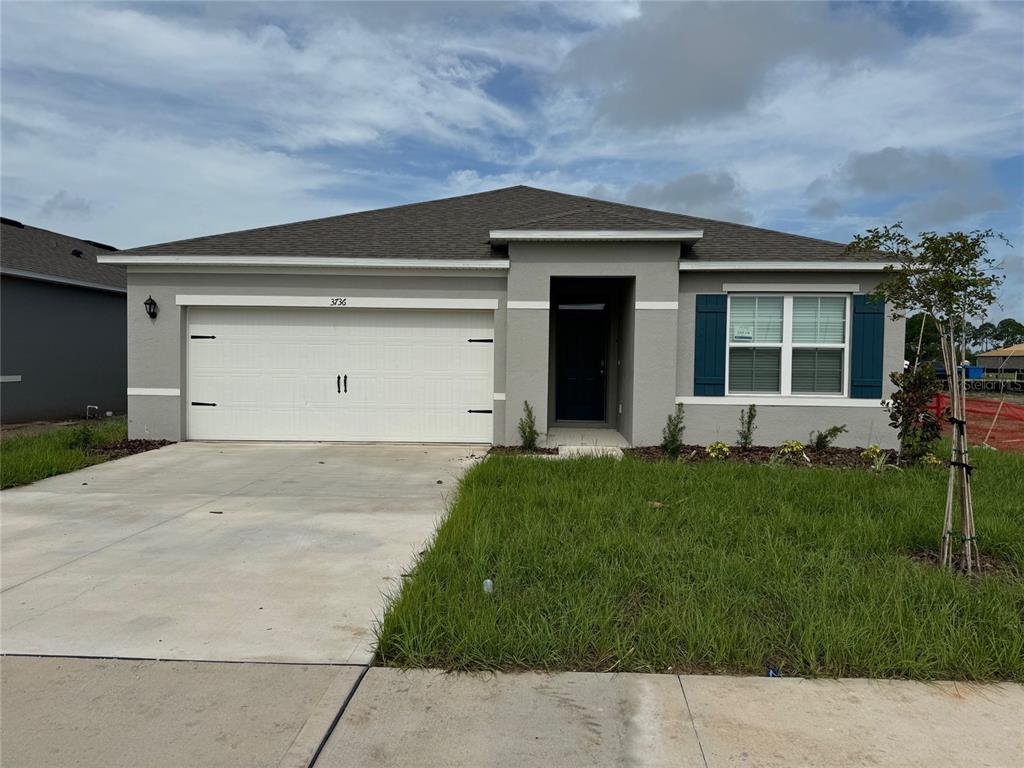 a front view of house with yard