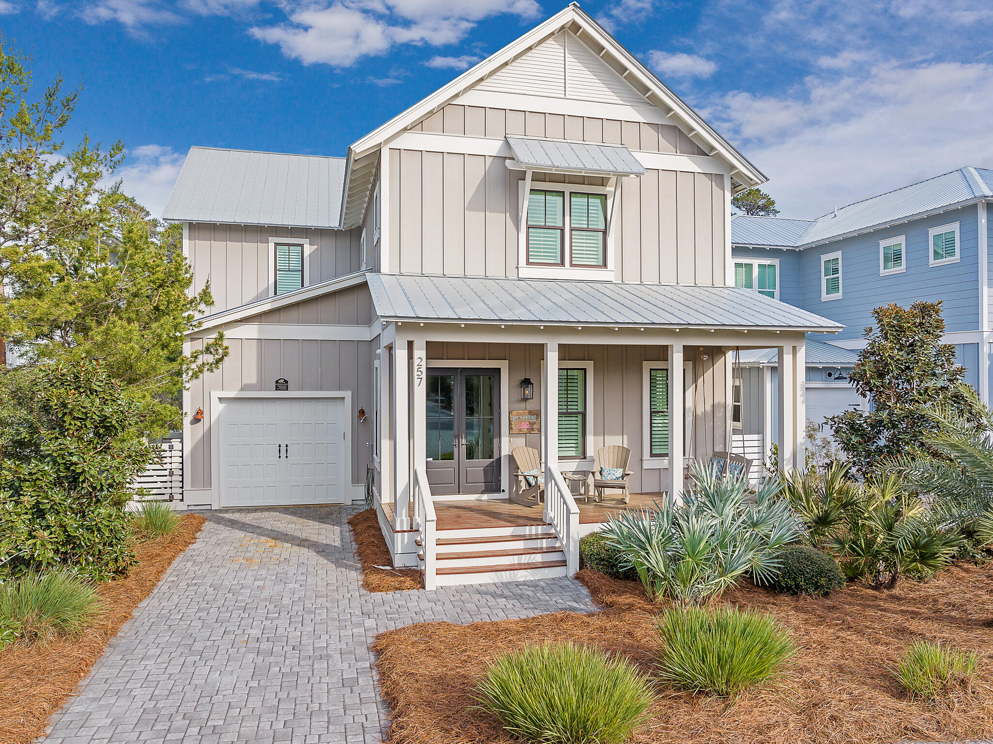 a front view of a house with a yard