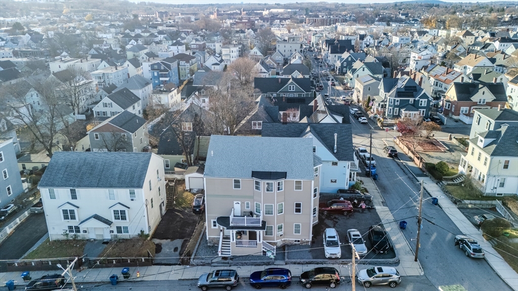 an aerial view of residential houses with outdoor space