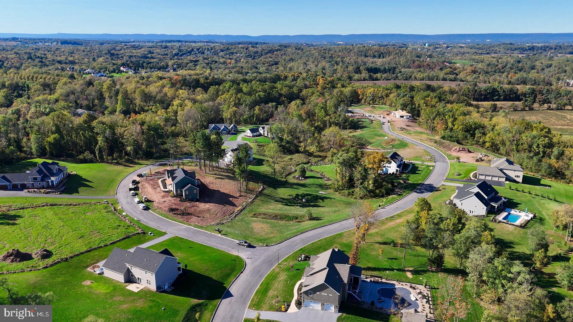 an aerial view of a house with a garden