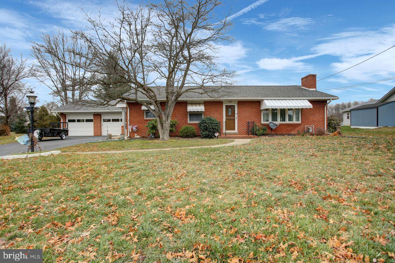 front view of a house with a yard