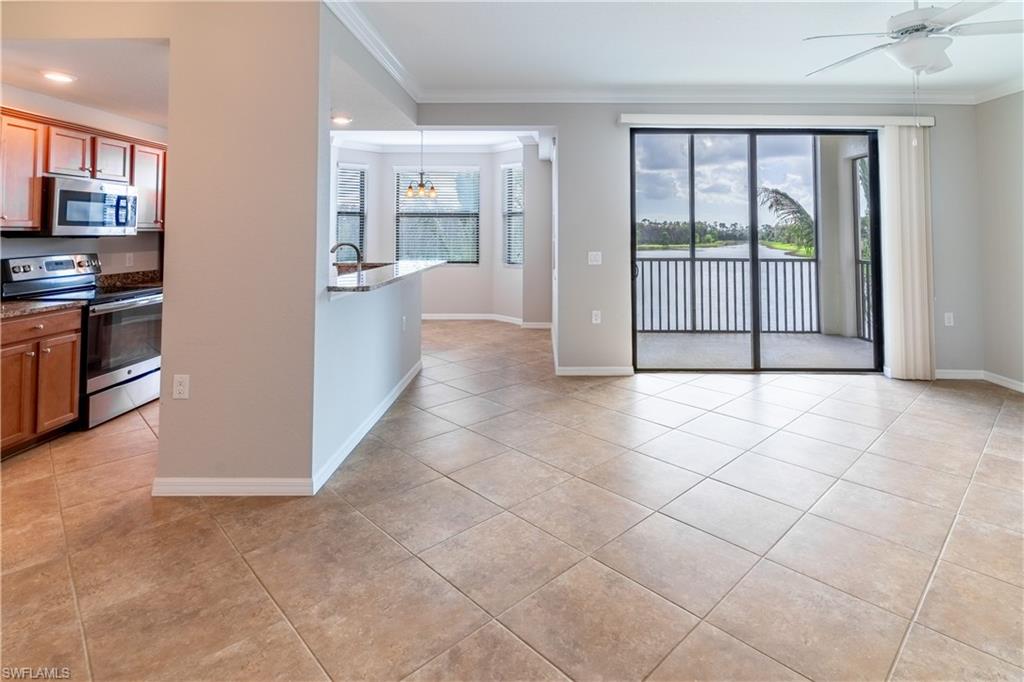 a view of a kitchen with an empty space and a window