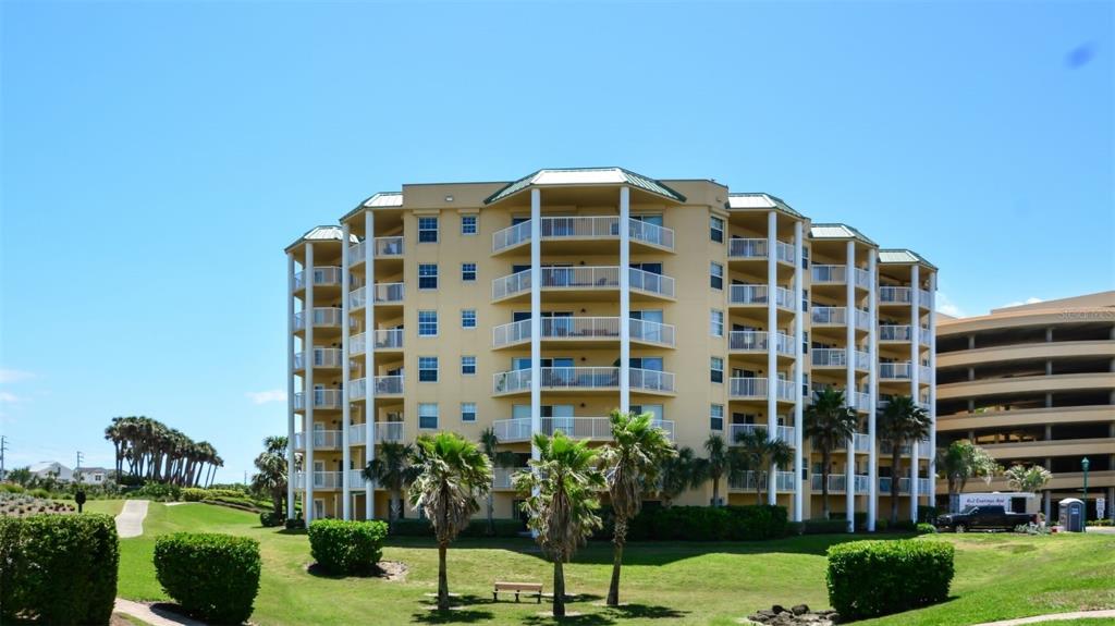 a view of a building with a yard