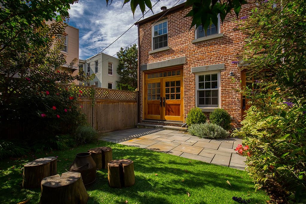 front view of a house with a yard