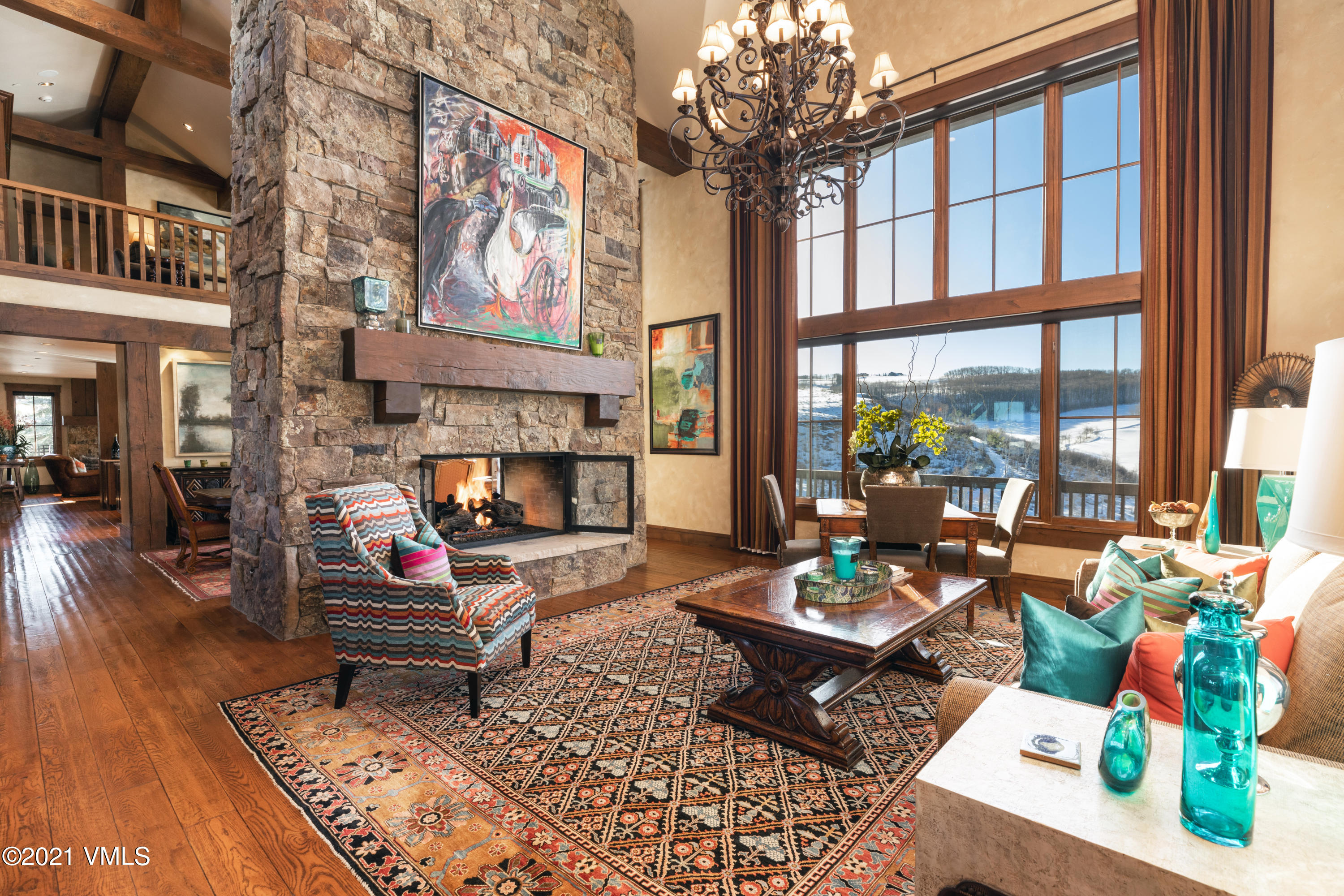 a living room filled with furniture and a potted plant