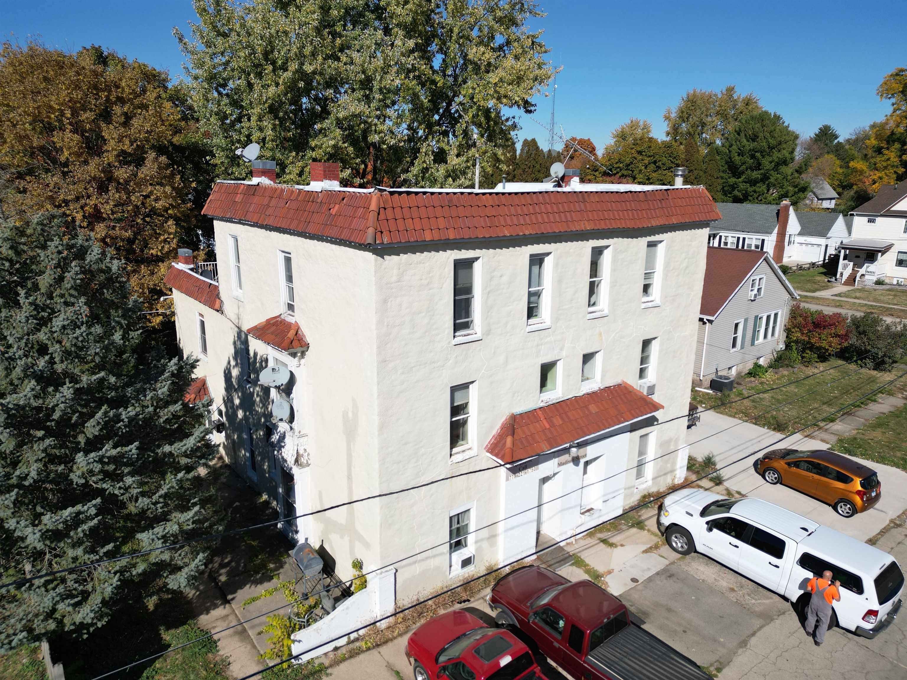 aerial view of a house with a yard