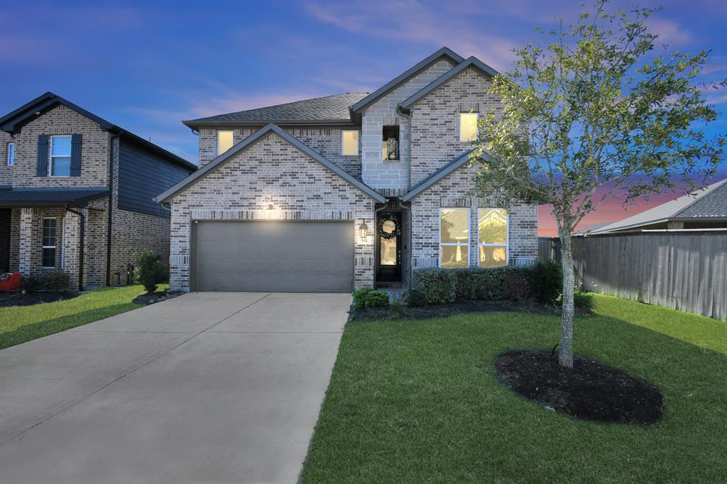 Welcome home to 532 Winburn Tide Lane! This stunning home has a modern curb appeal, brick elevation, covered front porch, and double-wide driveway!