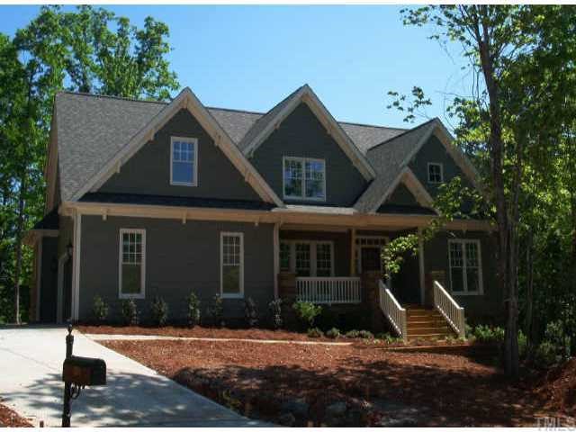 a front view of a house with yard