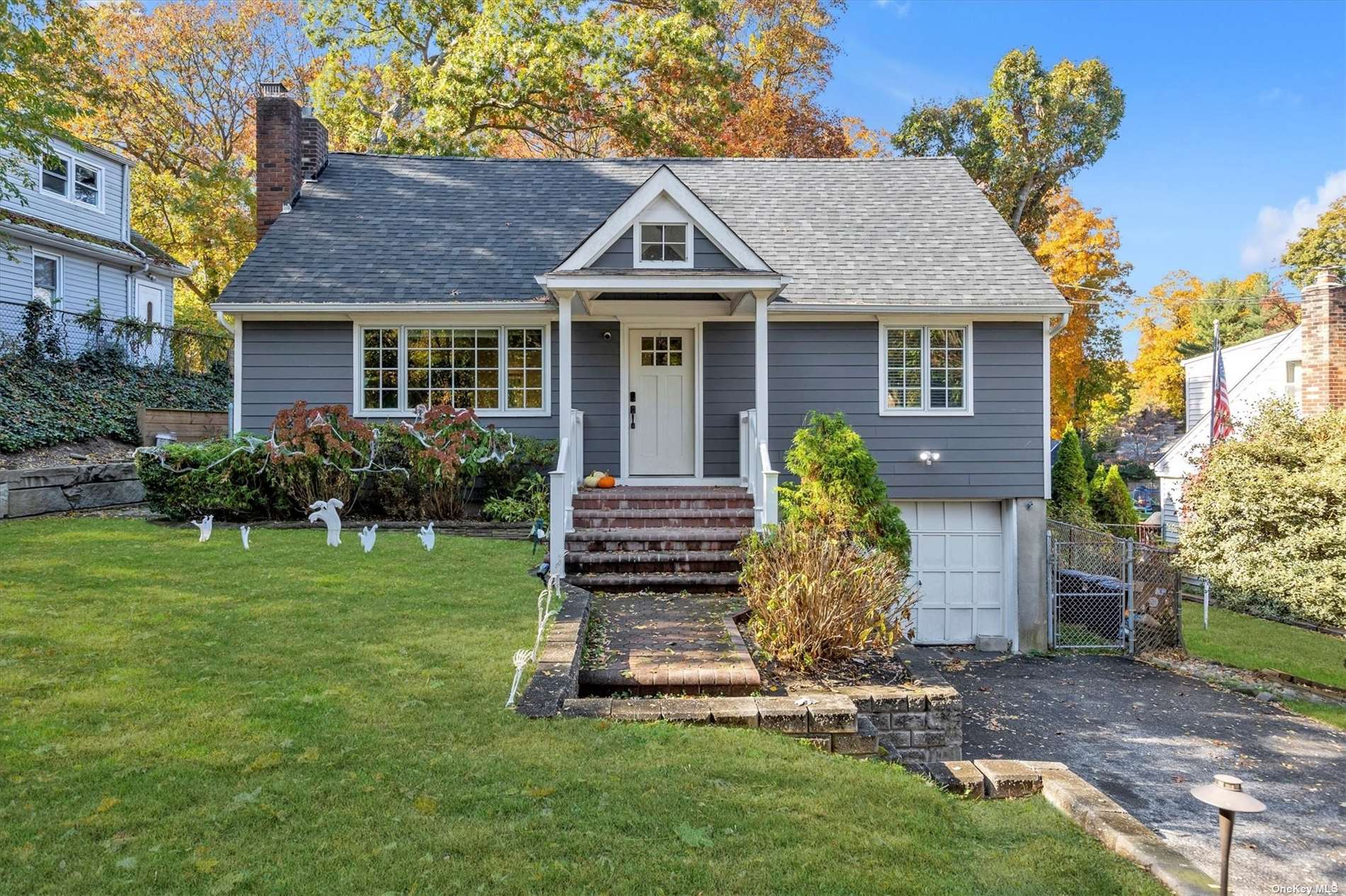 a front view of a house with a garden