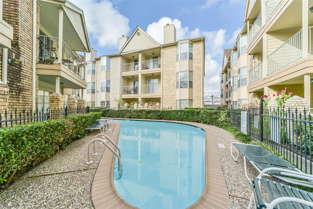 a view of a swimming pool with a patio