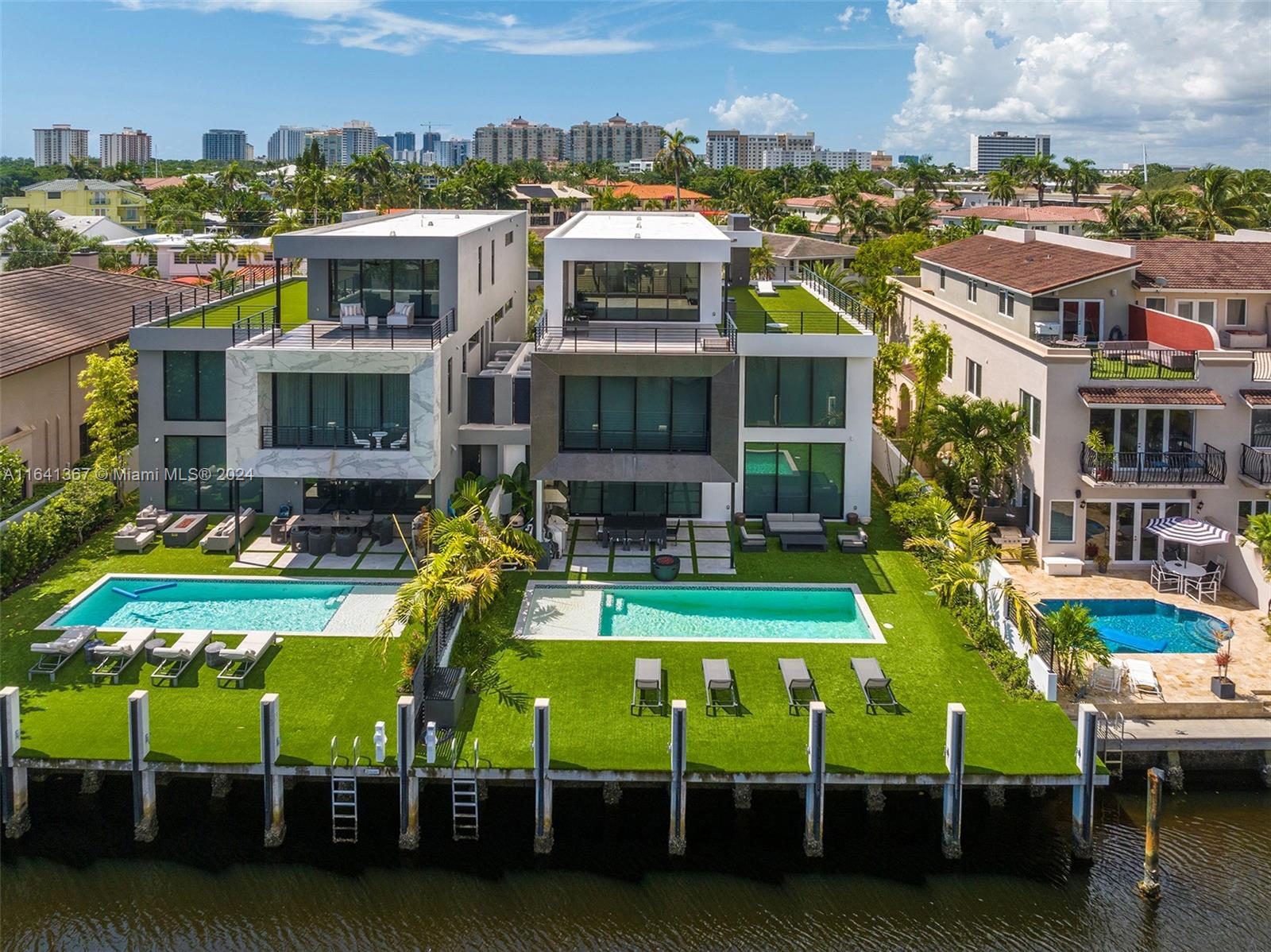 a view of a house with a swimming pool outdoor seating area and furniture