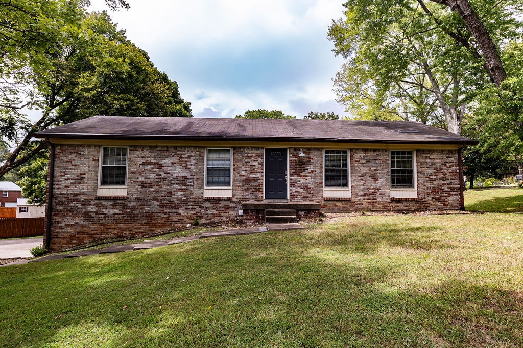 a view of a house with backyard porch and sitting area