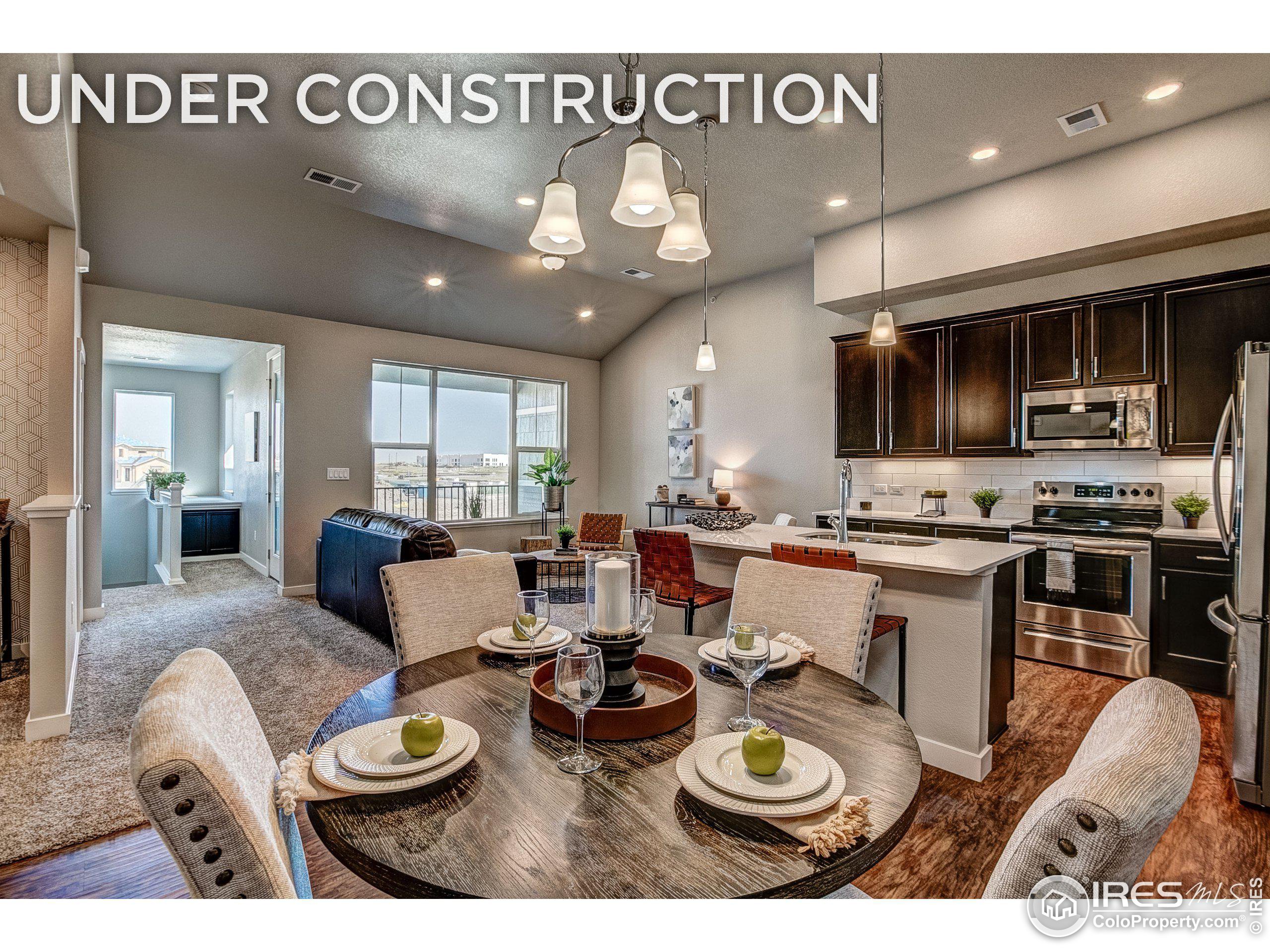 a kitchen with a table and chairs