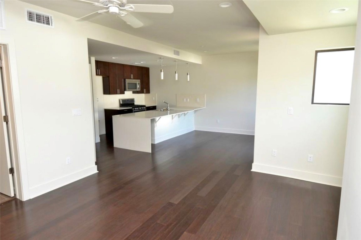 View to Kitchen island & front door when vacant.