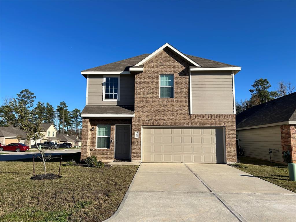 Here is a view of the front of the house showcasing its curb appeal and welcoming entrance.