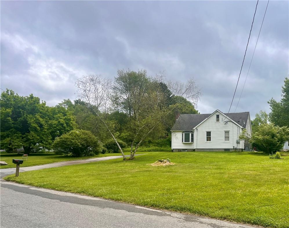 View of front of home featuring a front lawn