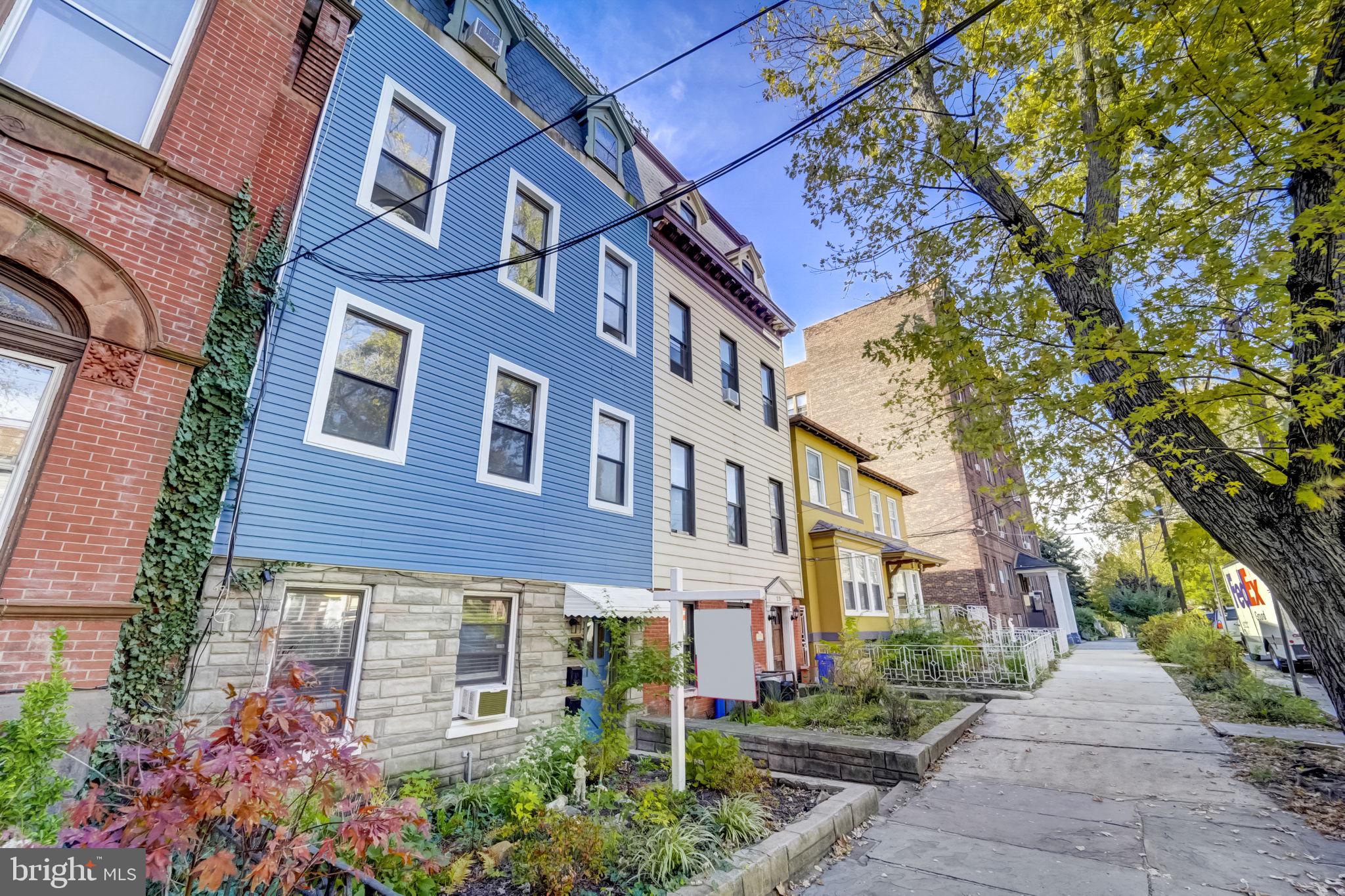 a view of a building next to a yard