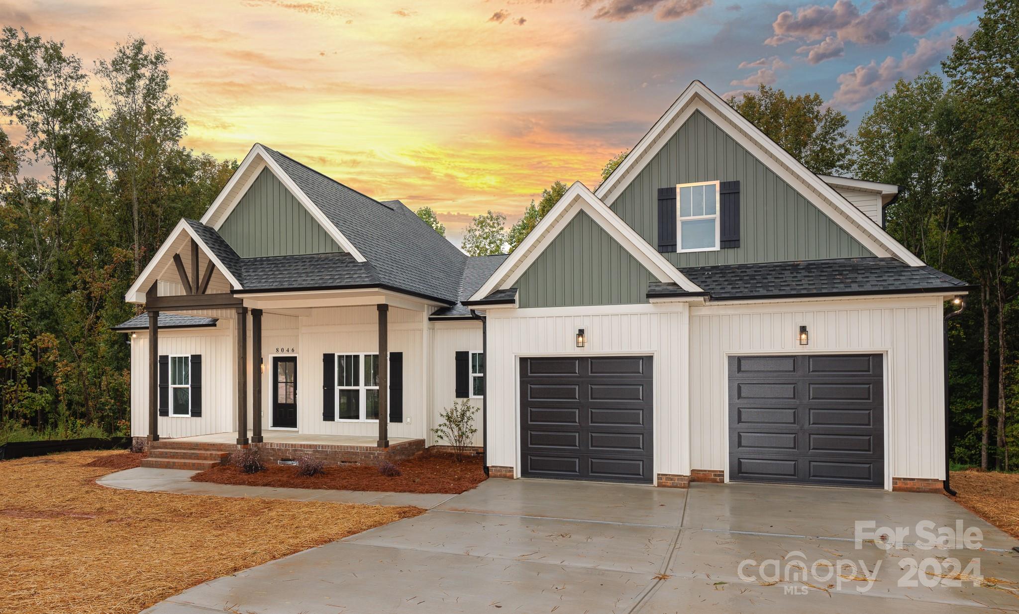 a front view of a house with garage