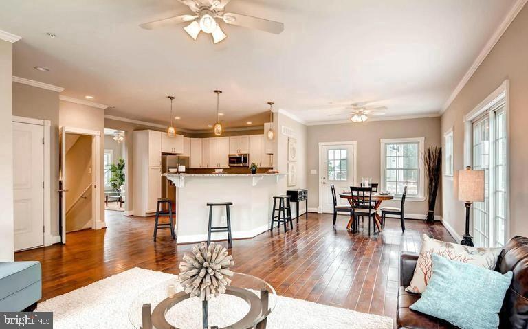 an open kitchen with dining table and sink