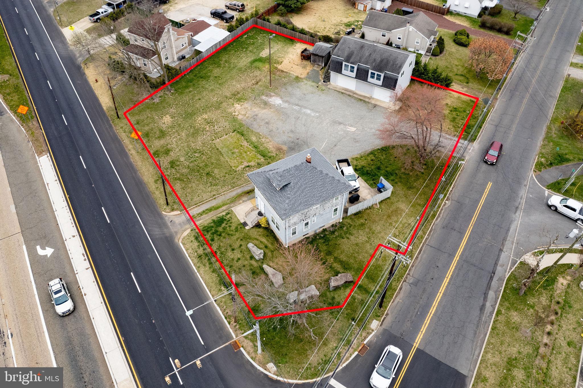 an aerial view of a house with a swimming pool