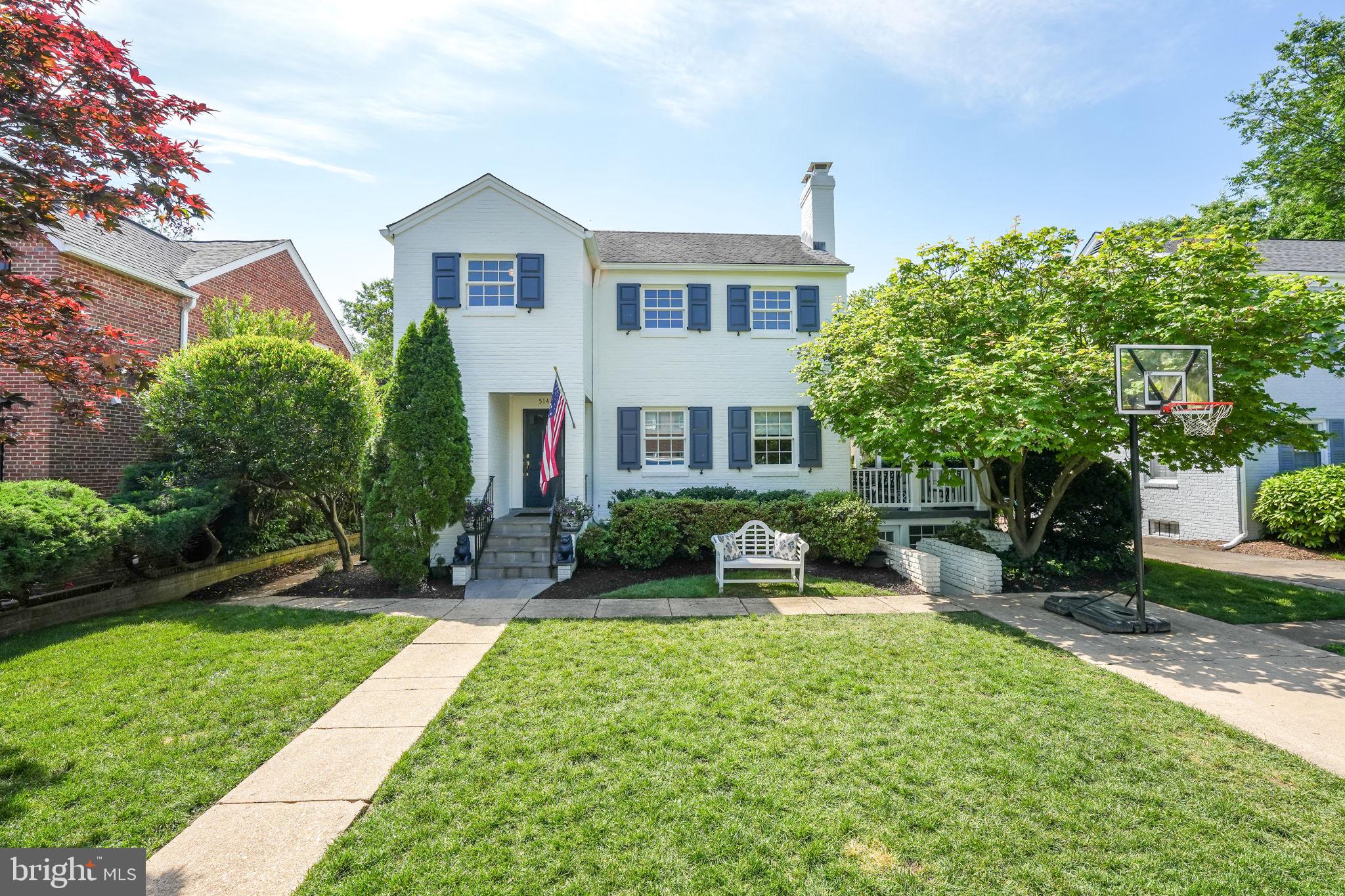 a front view of a house with a yard and porch